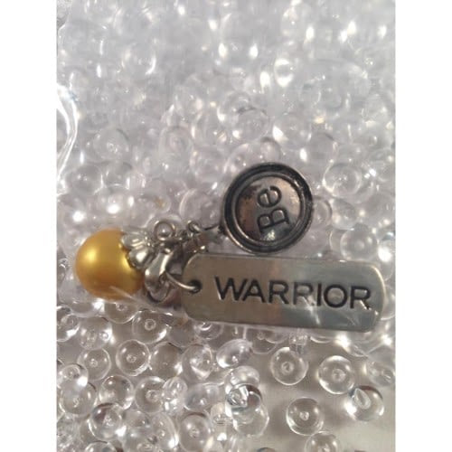 Auzz Trinklets Pearl Charms Dark yellow with words Warrior / Be